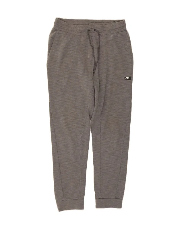 Minimalist Style NIKE Mens Tracksuit Trousers Joggers Medium Grey Cotton