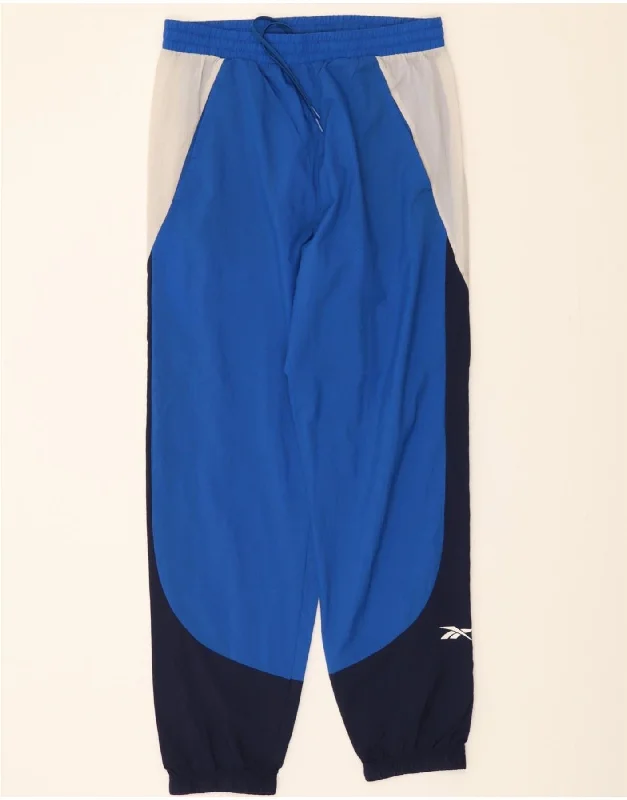 Sporty Chic REEBOK Mens Tracksuit Trousers Joggers Medium  Blue Colourblock Polyamide